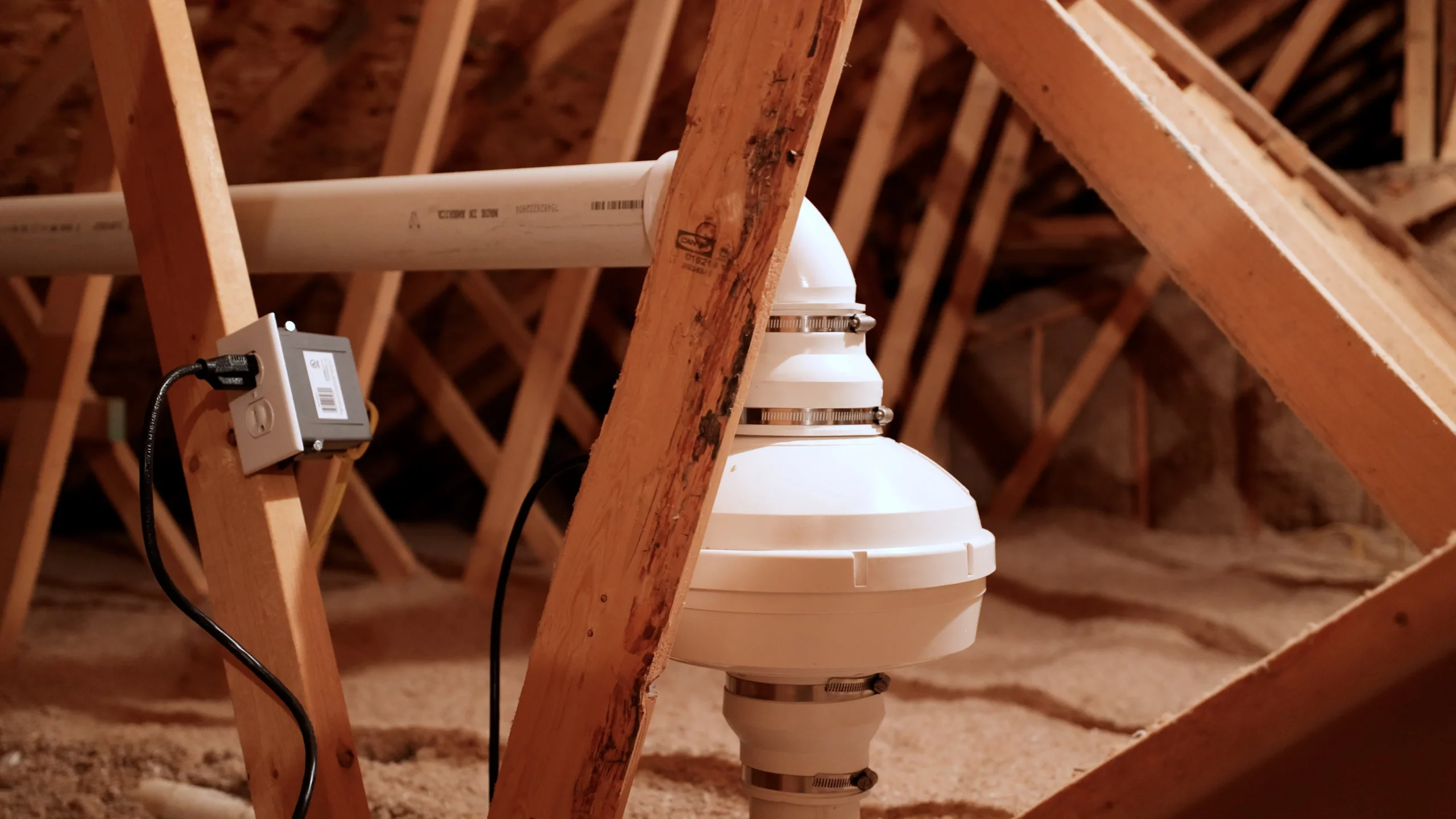 Radon fan and vent piping installed in an attic